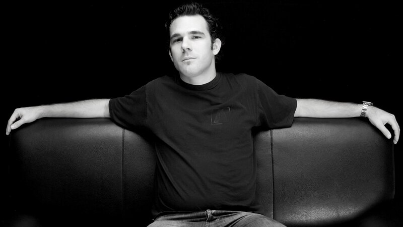 man sitting on black couch