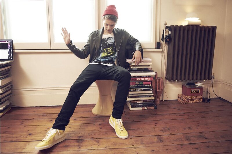 Man Sitting on Books — Brown
