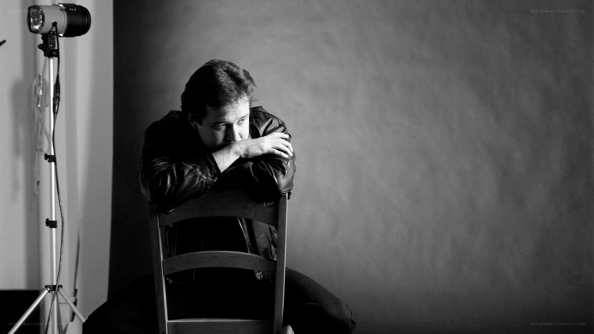 man sitting on chair in studio
