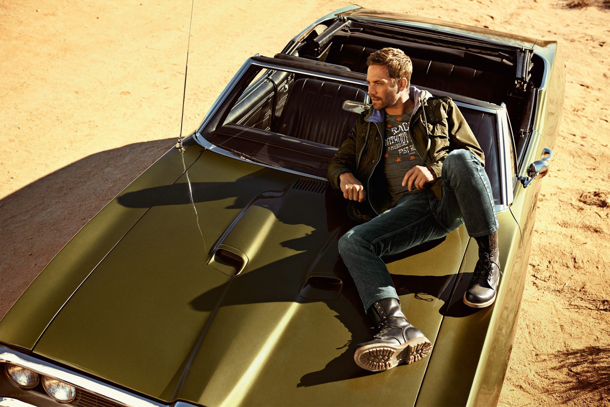 Man sitting on classic car