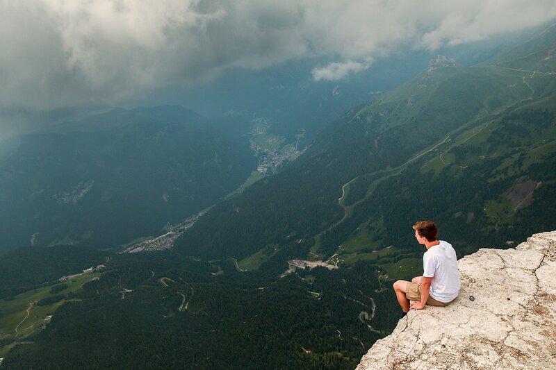 Man Sitting on Cliff — Green, Serene