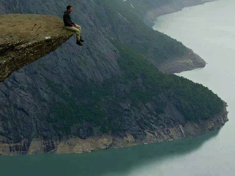 Man Sitting on Cliff — Green