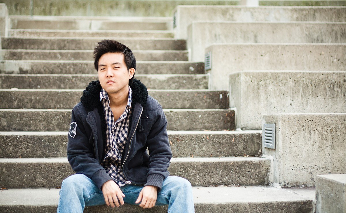 man sitting on concrete steps