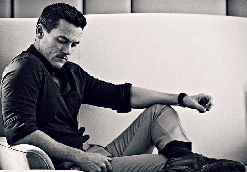 Man Sitting on Couch — Black, Contemplative