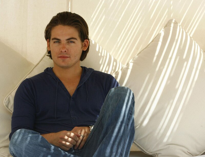 Man Sitting on Couch — Blue, Relaxed
