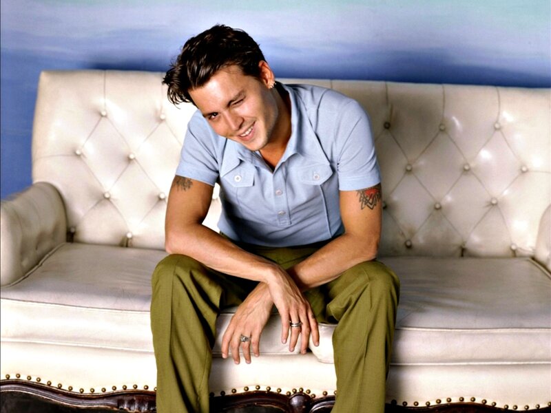 Man Sitting on Couch — Blue