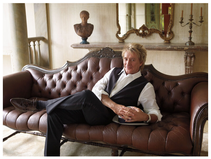 Man Sitting on Couch — Brown