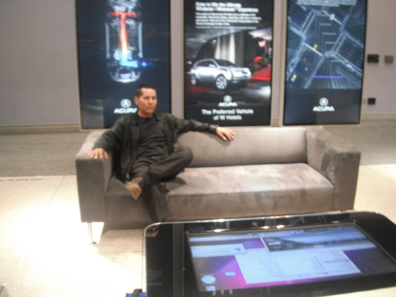 Man Sitting on Couch — Gray