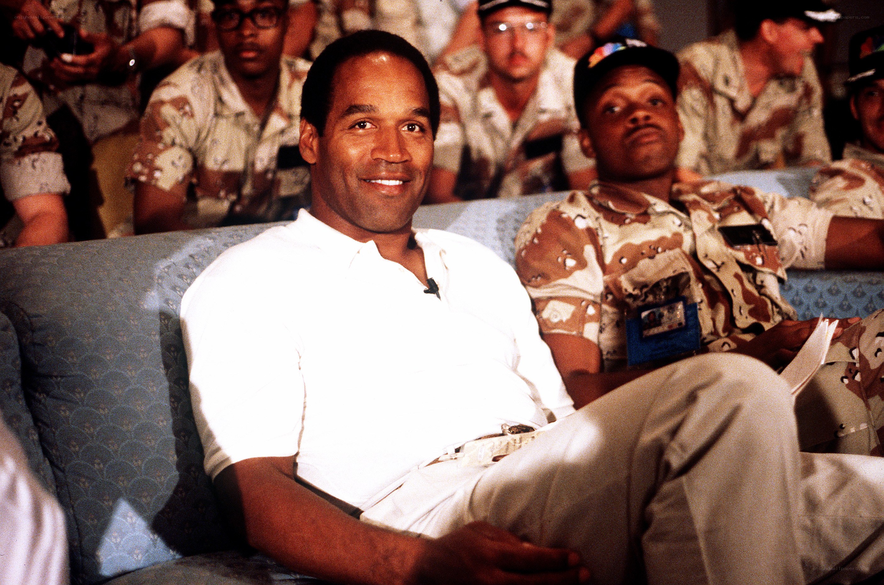 Man sitting on couch with soldiers