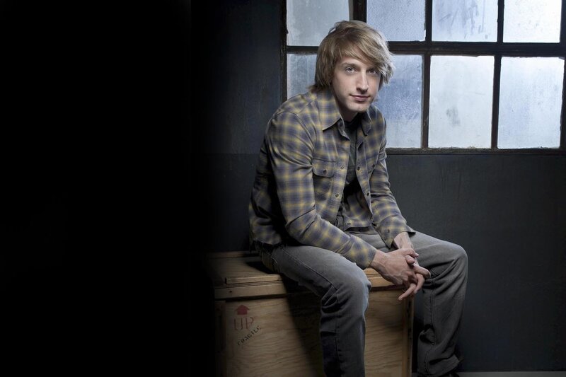 Man Sitting on Crate