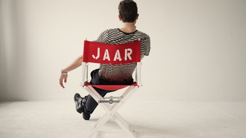 Man sitting on director's chair