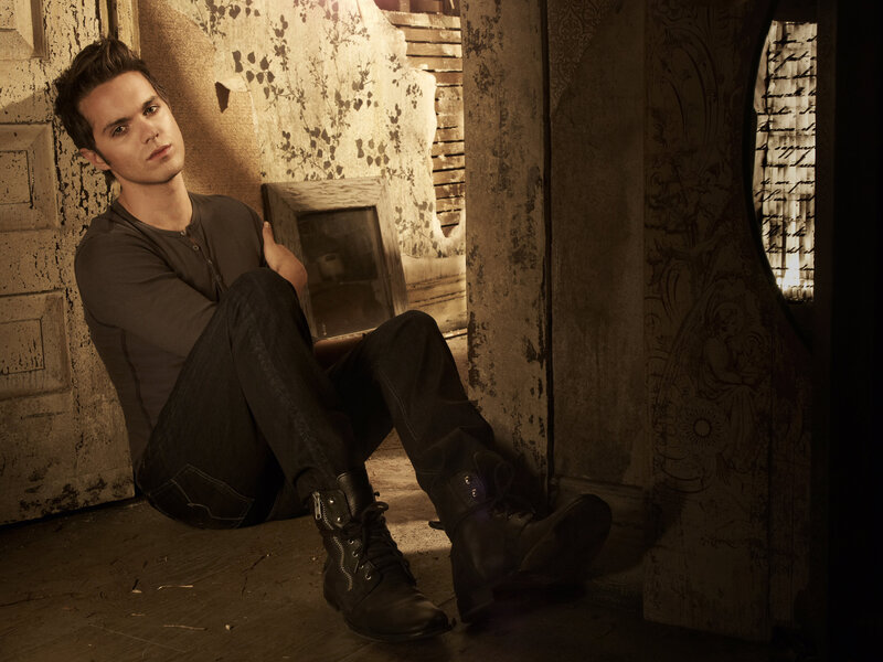 Man Sitting on Floor — Brown, Dramatic, Photograph, Wall