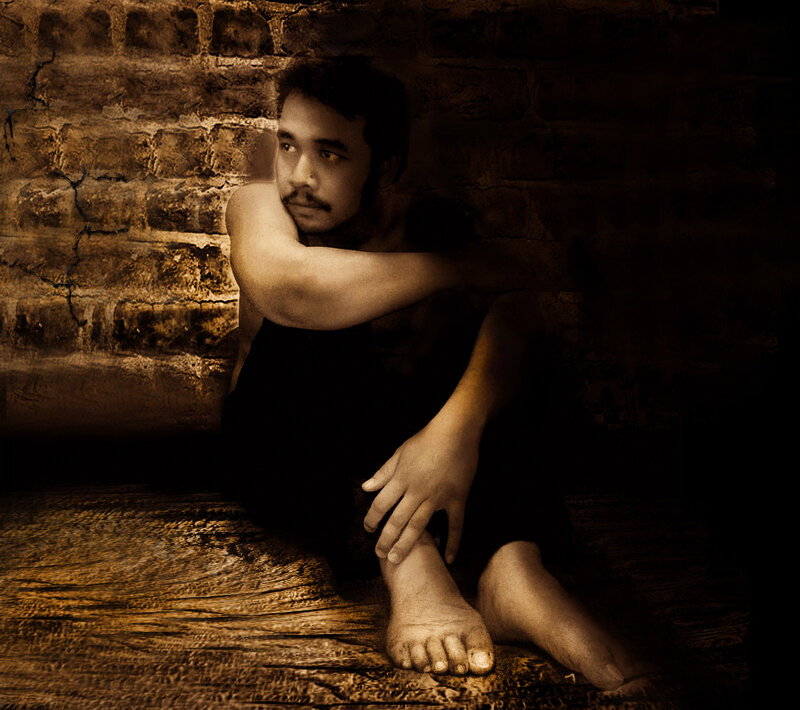 Man Sitting on Floor — Brown