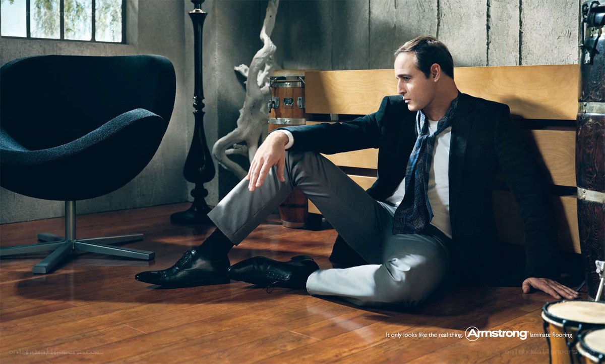 man sitting on floor in suit
