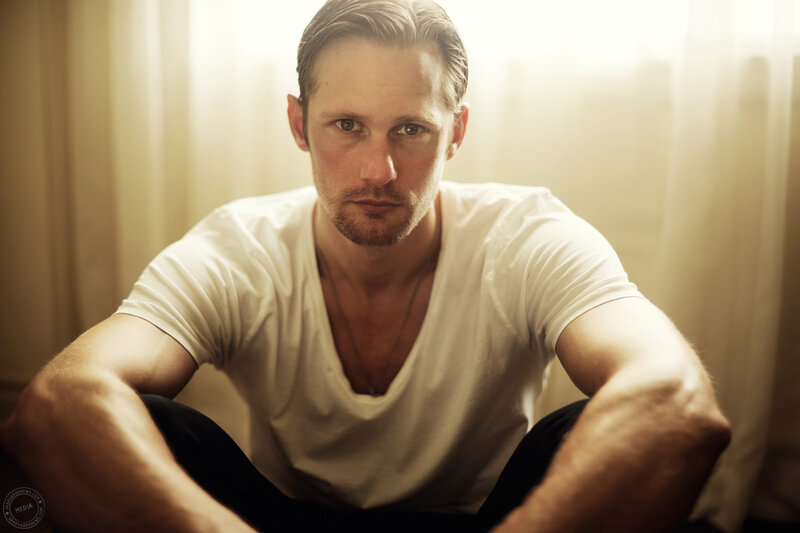 Man Sitting on Floor — White, Dramatic