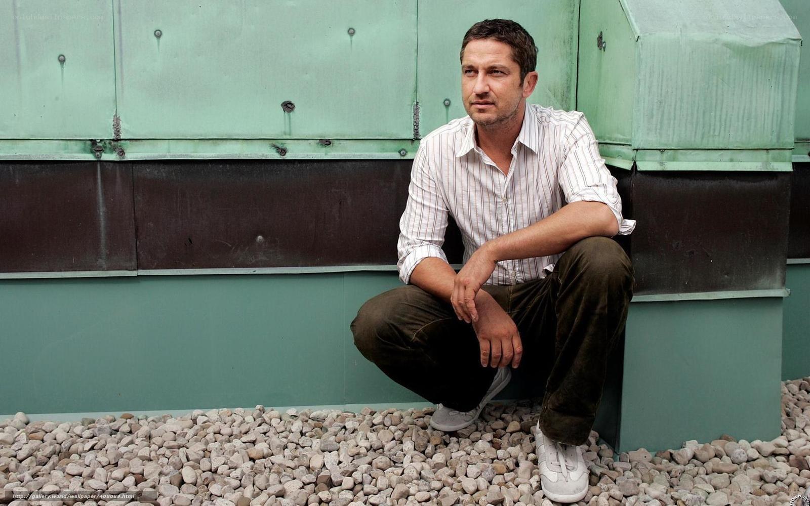 man sitting on gravel