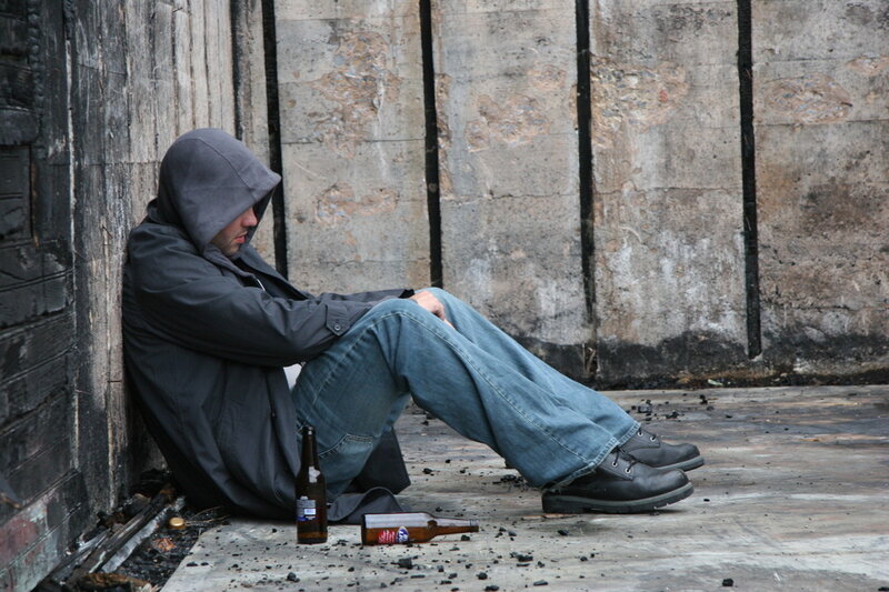 Man Sitting on Ground — Gray