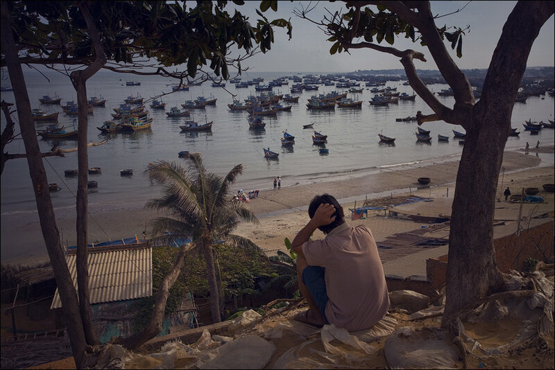 Man Sitting on Hill