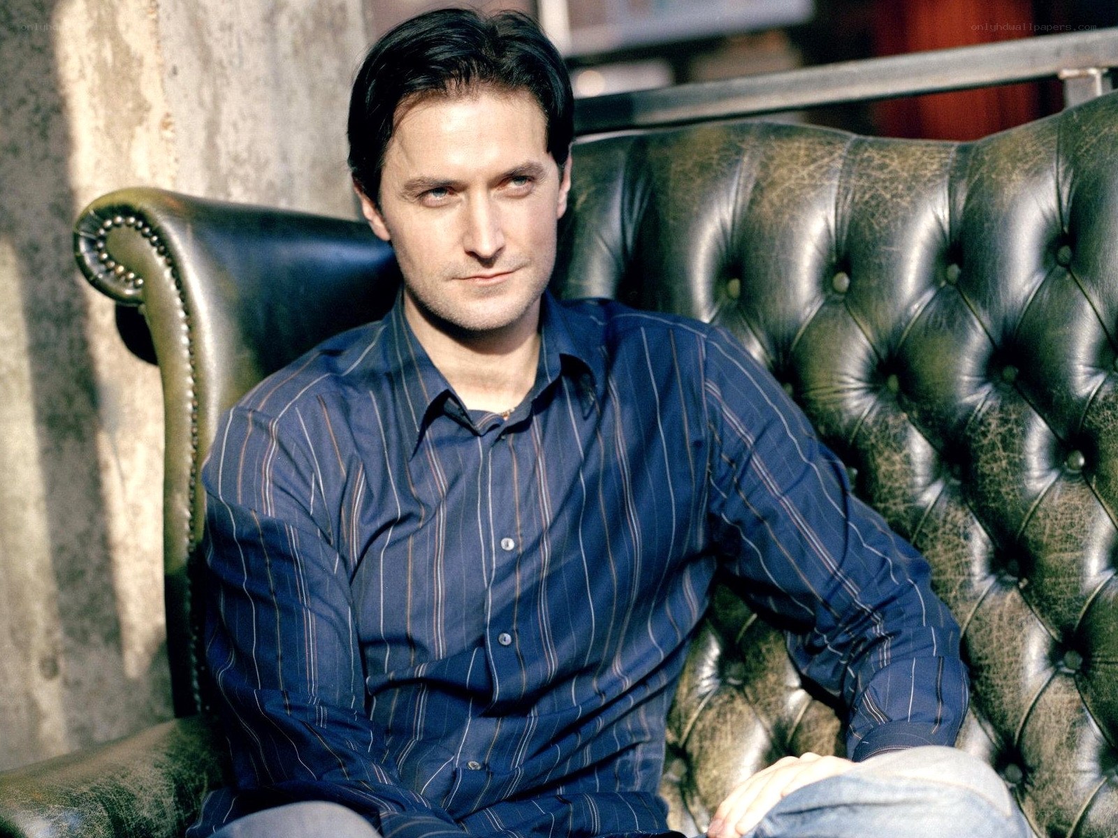 man sitting on leather chair