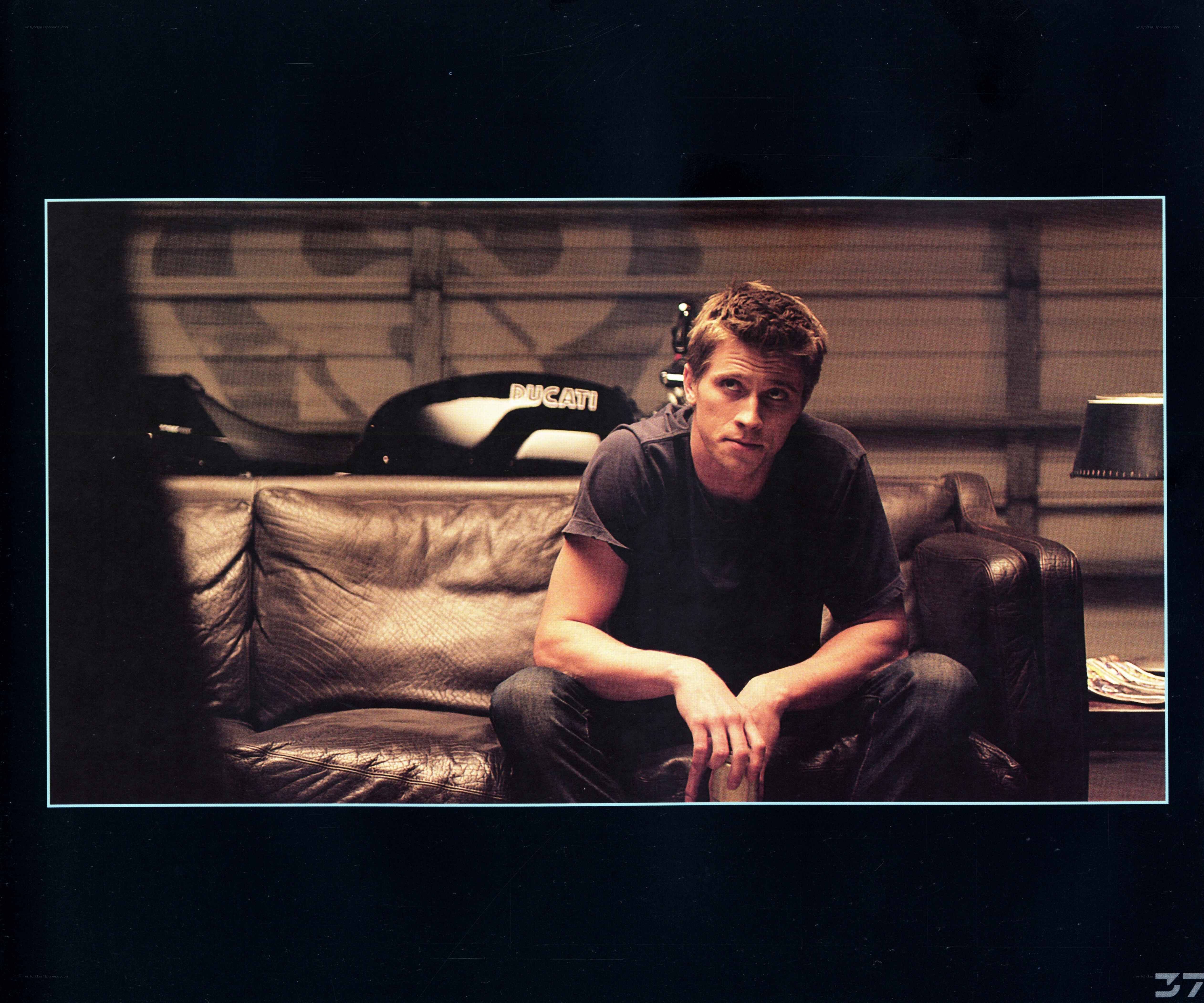 man sitting on leather couch