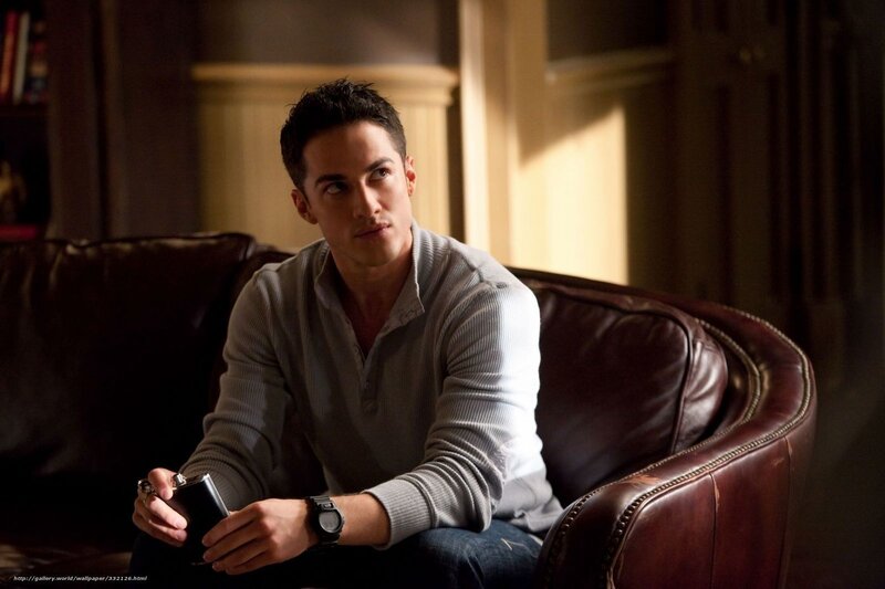 man sitting on leather couch