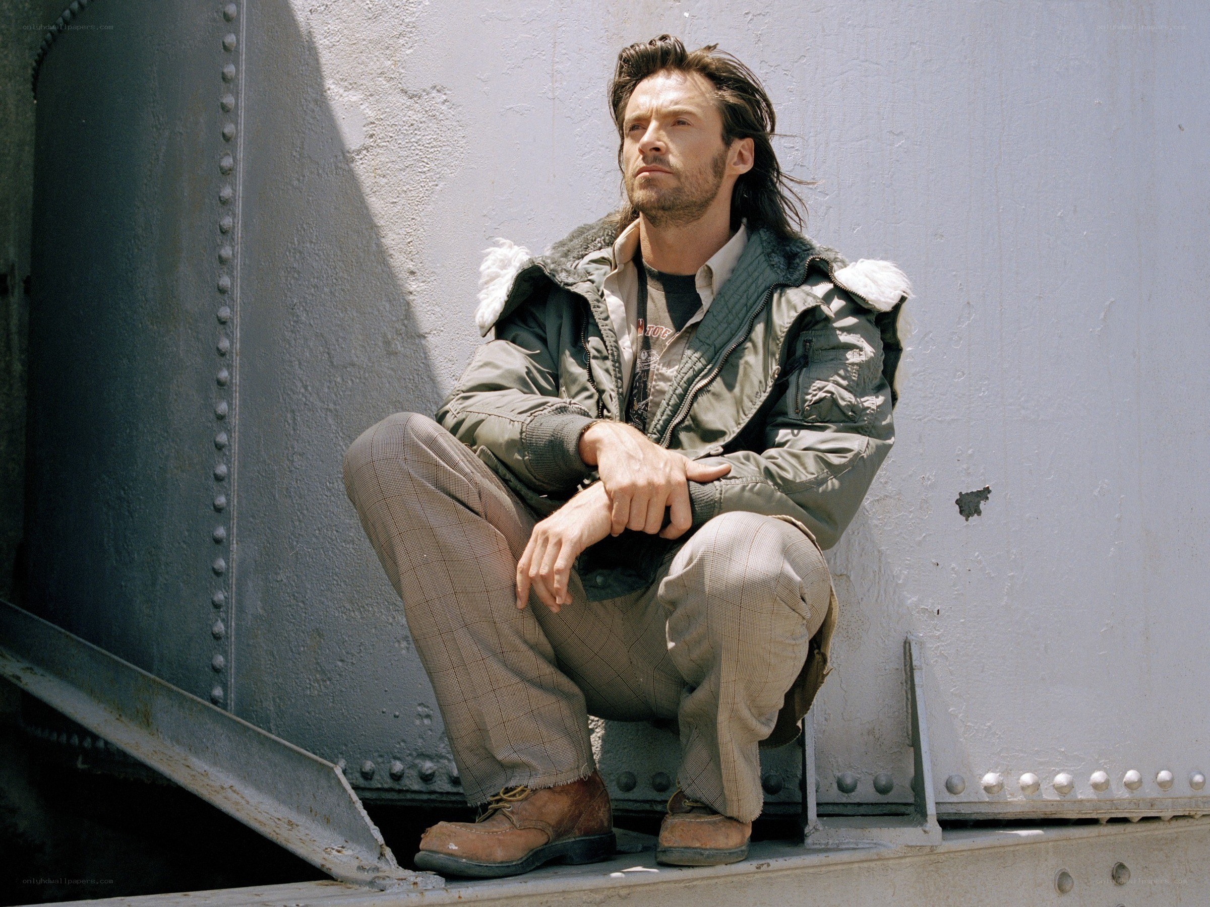 man sitting on metal structure