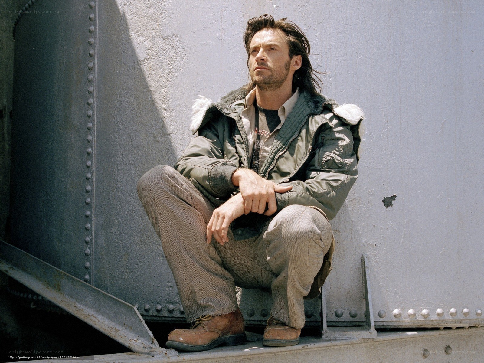 man sitting on metal structure