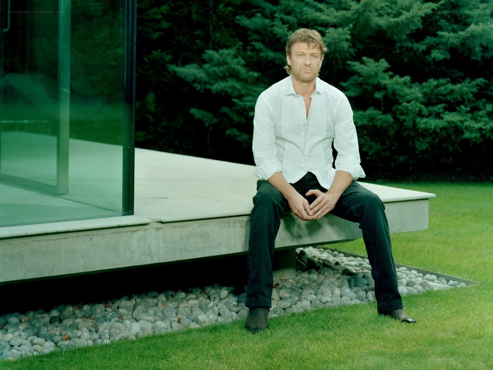 man sitting on modern bench