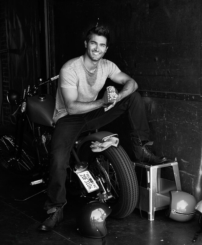 man sitting on motorcycle