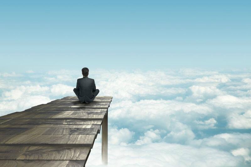 Man Sitting on Pier
