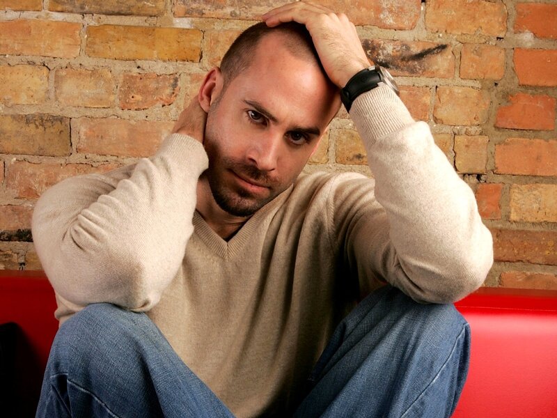 Man Sitting on Red Bench — Contemplative