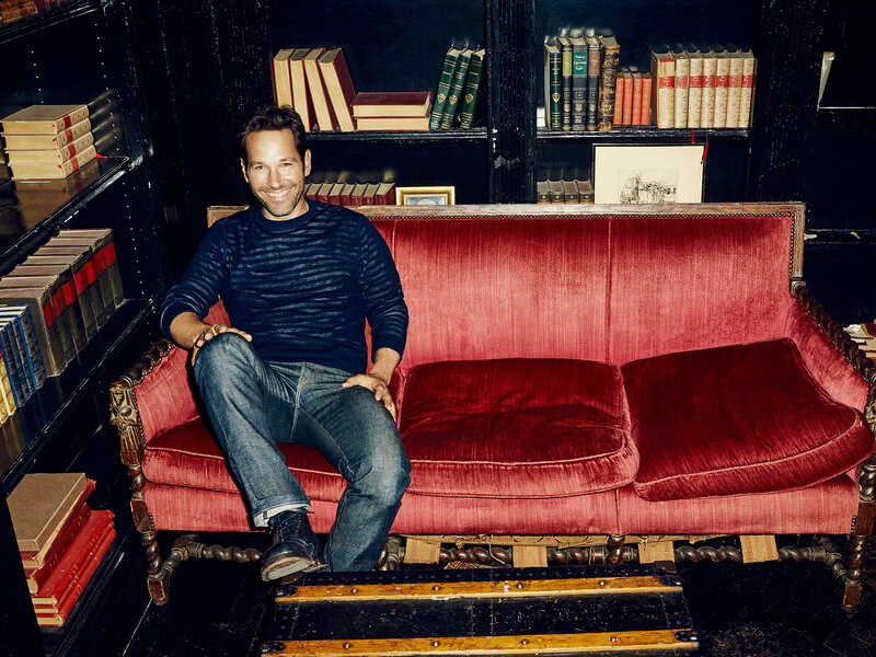 man sitting on red couch