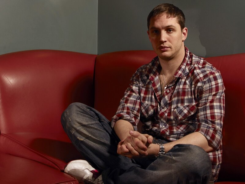 Man Sitting on Red Couch — Neutral