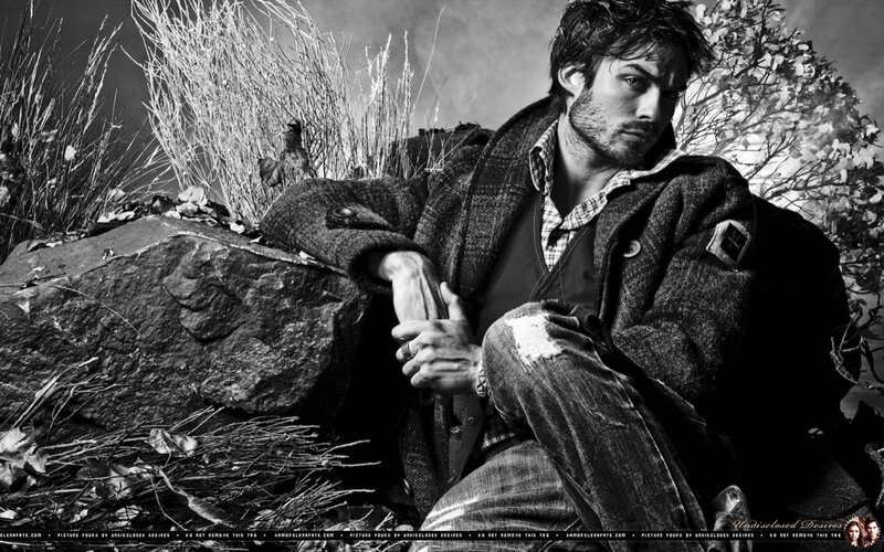 Man Sitting on Rock — Black