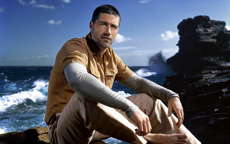 Man Sitting on Rocks — Blue, Dramatic