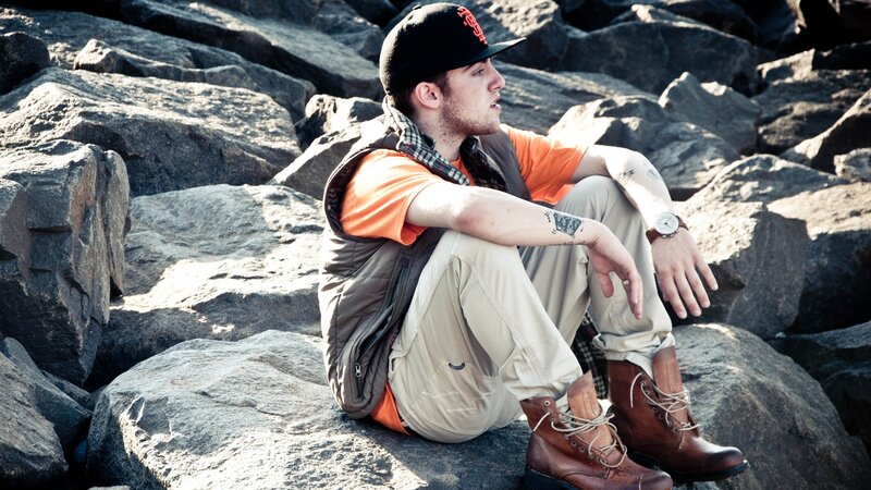 man sitting on rocks