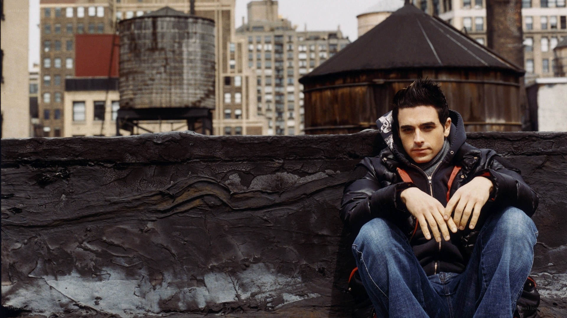 man sitting on rooftop
