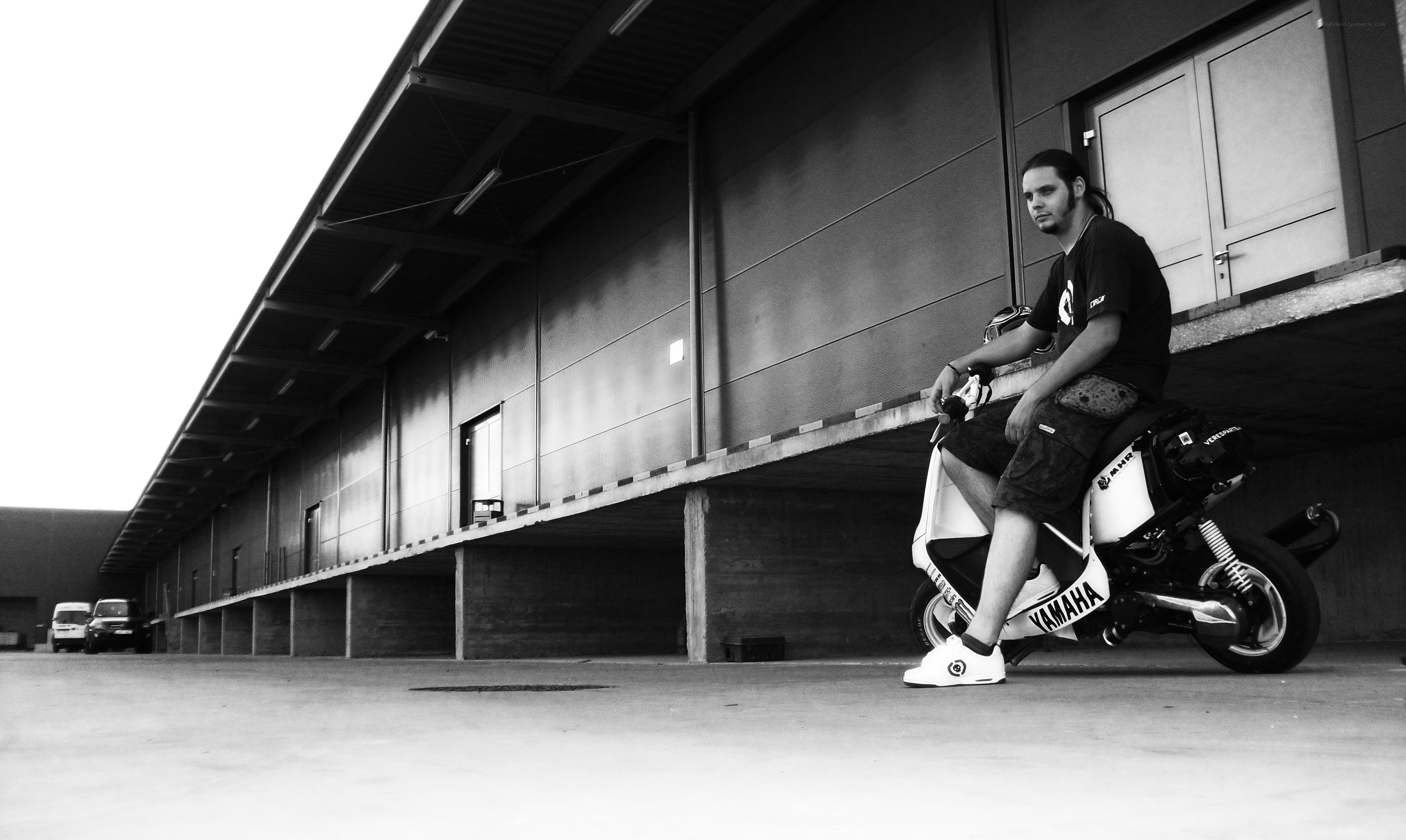 man sitting on scooter