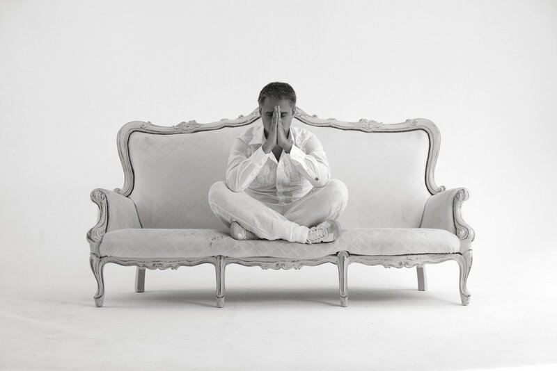 Man Sitting on Sofa — White