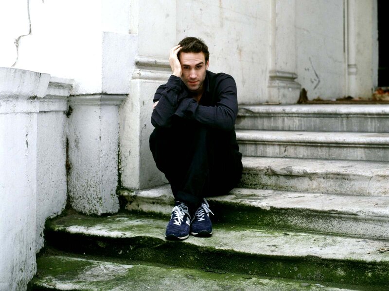Man Sitting on Steps — Black, Contemplative