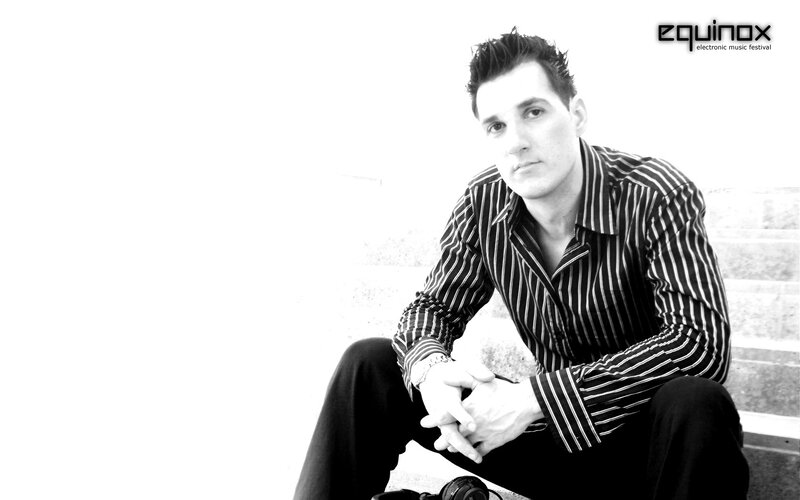 man sitting on steps in black and white