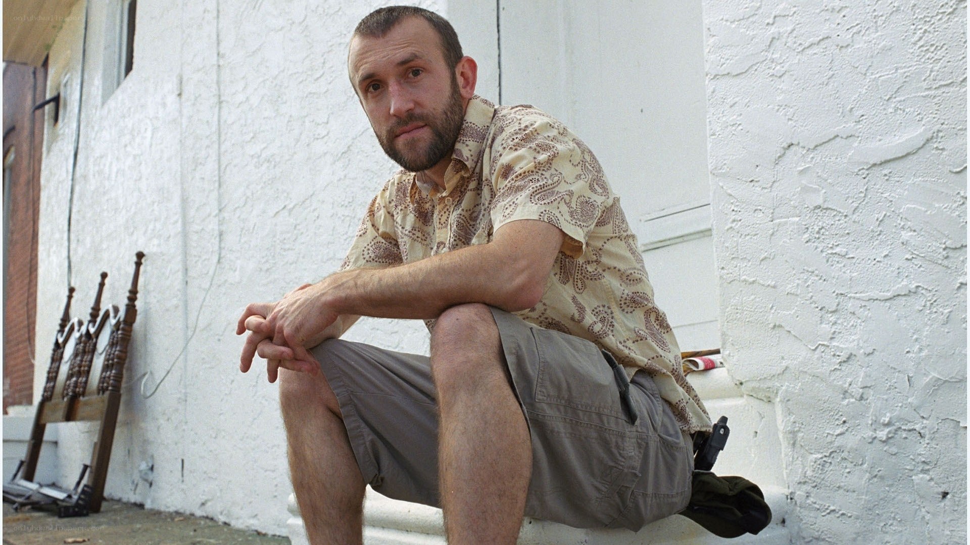man sitting on steps outdoors
