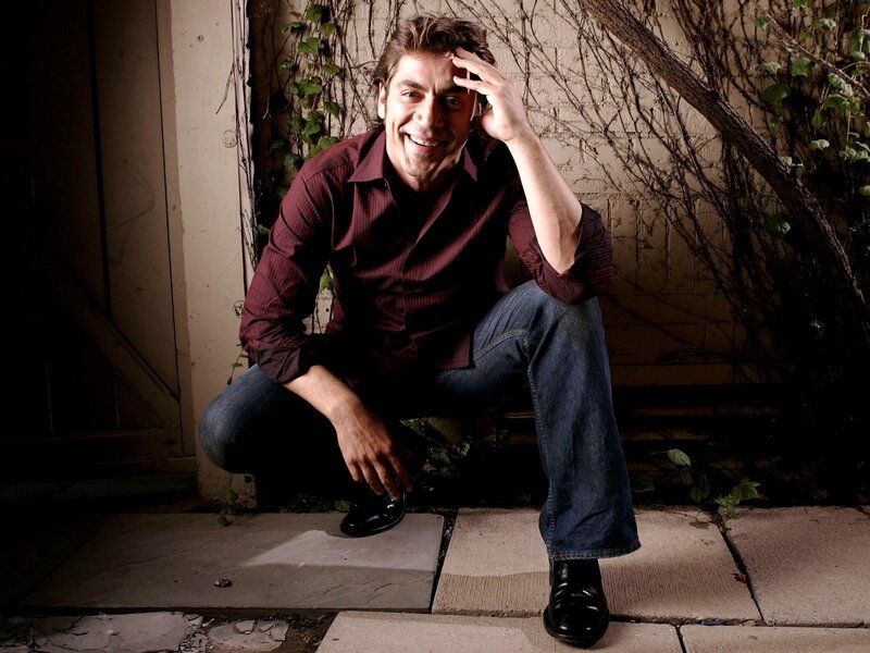 man sitting on steps smiling