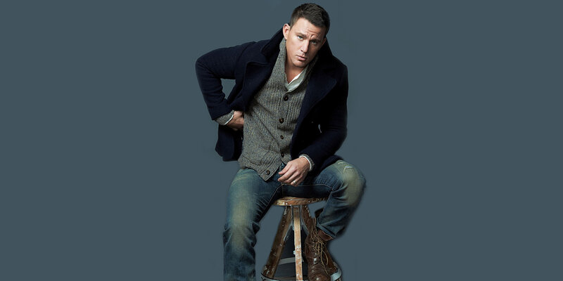 man sitting on stool in coat
