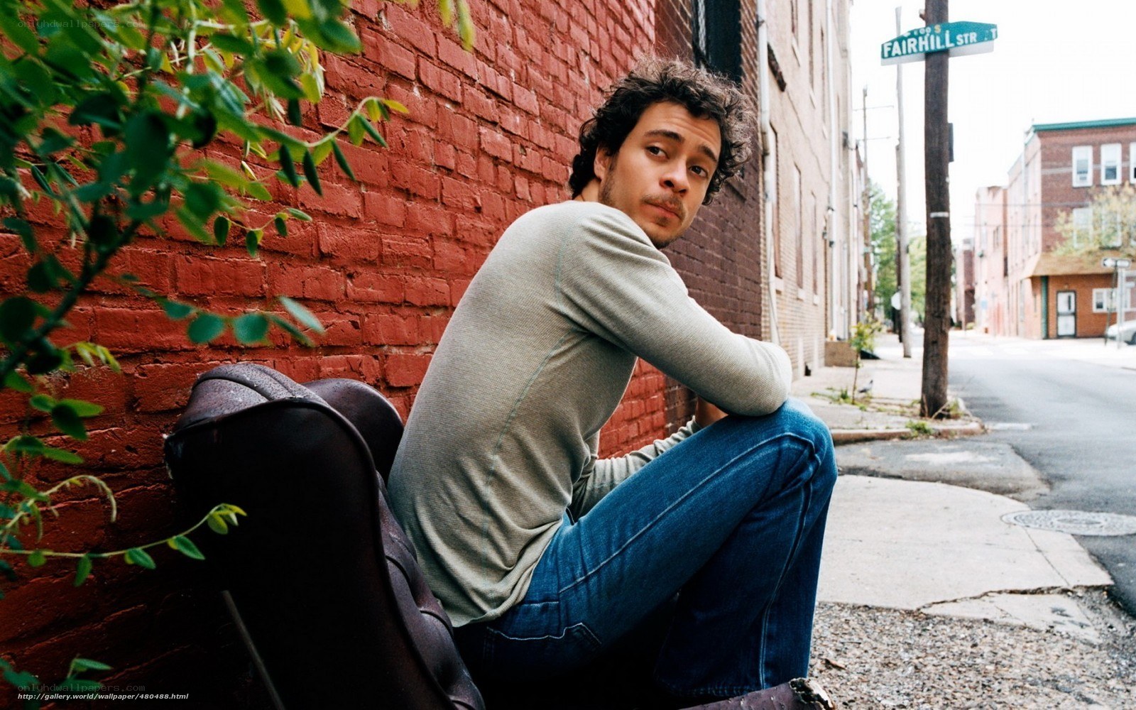 man sitting on street