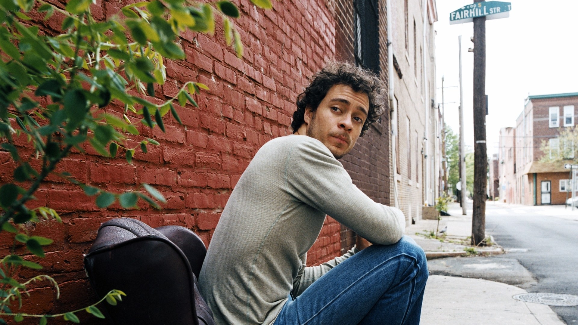 man sitting on street