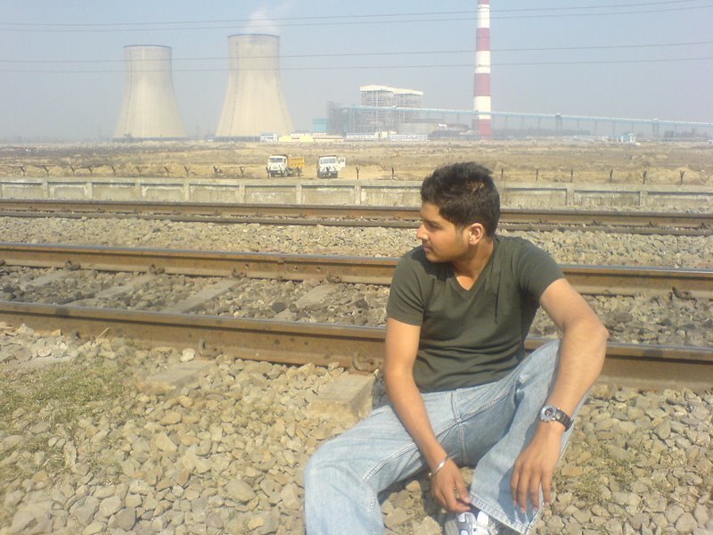 Man Sitting on Train Tracks — Green, Neutral