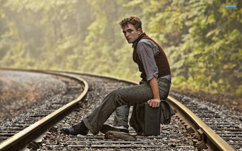Man Sitting on Train Tracks — Green