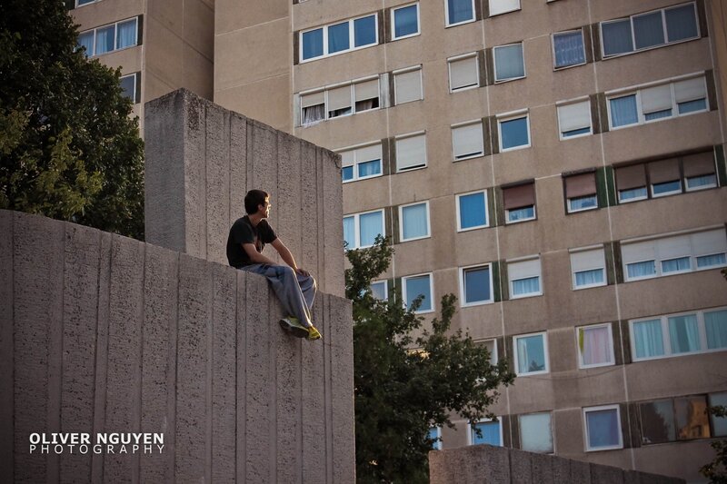 Man Sitting on Wall — Gray