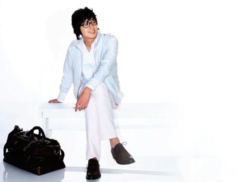 man sitting on white bench